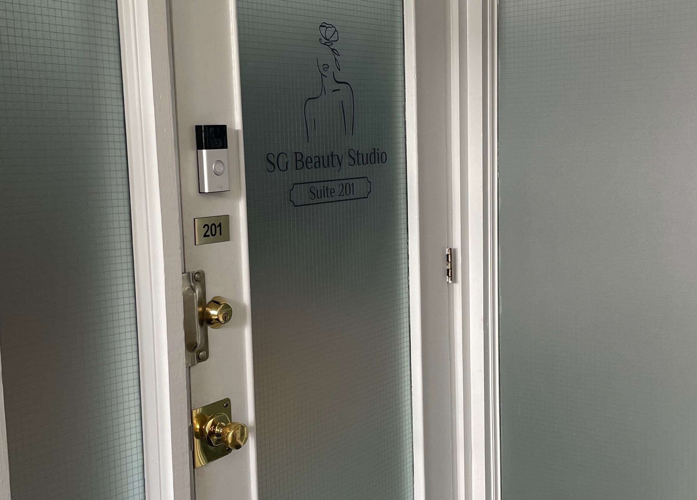 Entrance of SG Beauty Studio at The Wink Room, Gatineau, Québec, CA featuring frosted glass doors.