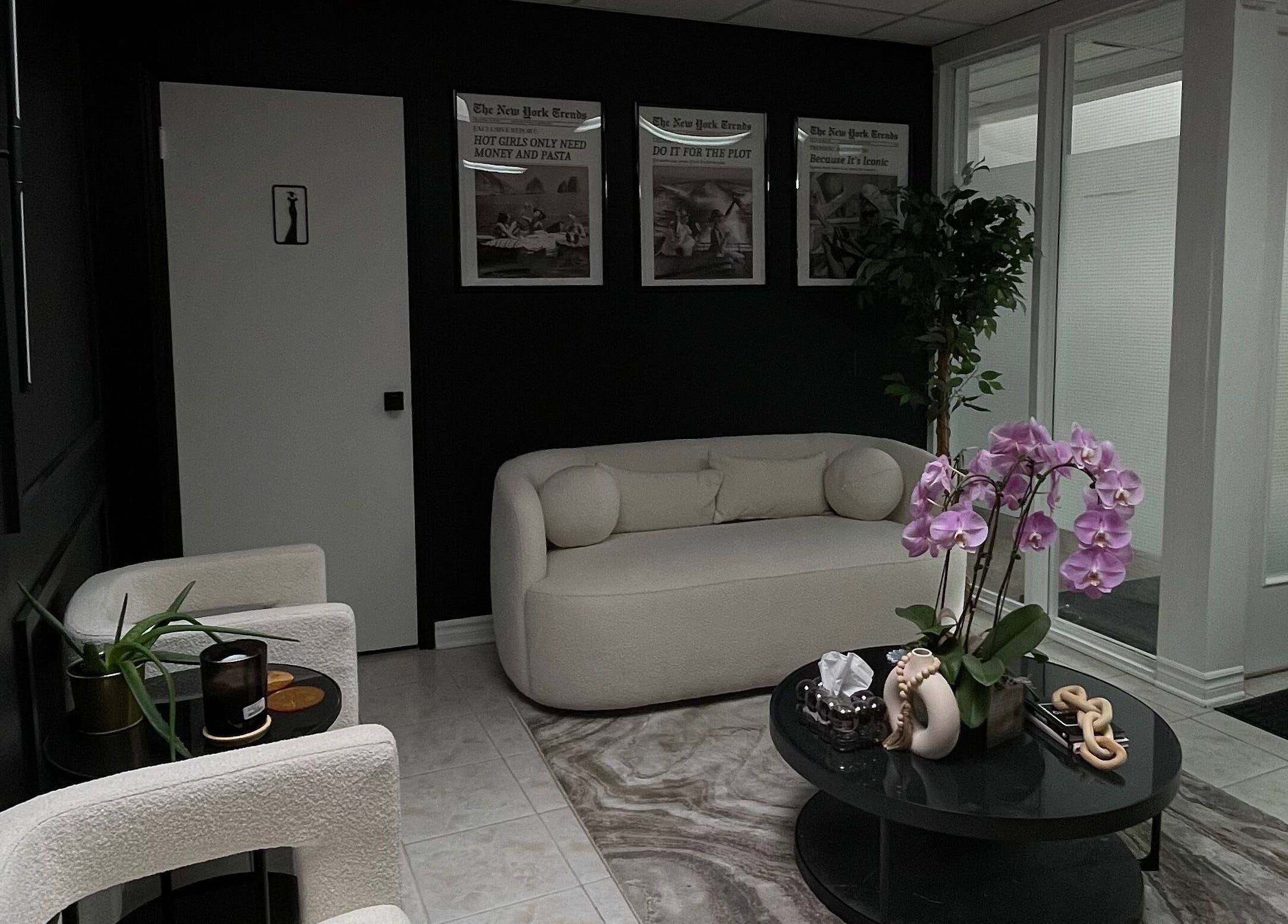 Sophisticated waiting area at The Wink Room, Gatineau, Québec, CA, featuring plush seating and a modern design.