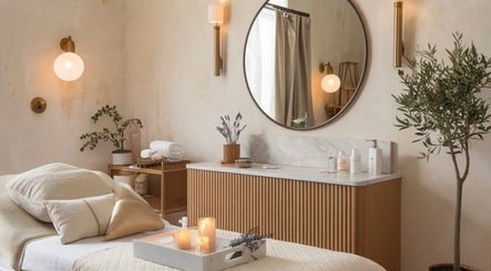 Elegant spa room at Restore & Renew, Boston, Massachusetts, US, featuring cozy bedding and ambient lighting.