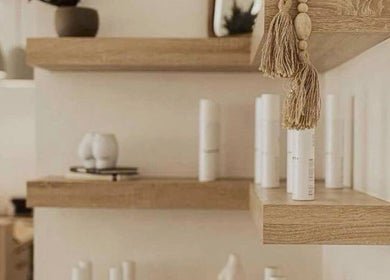 Elegant shelving with wellness products at Restore & Renew, Boston, Massachusetts, US.