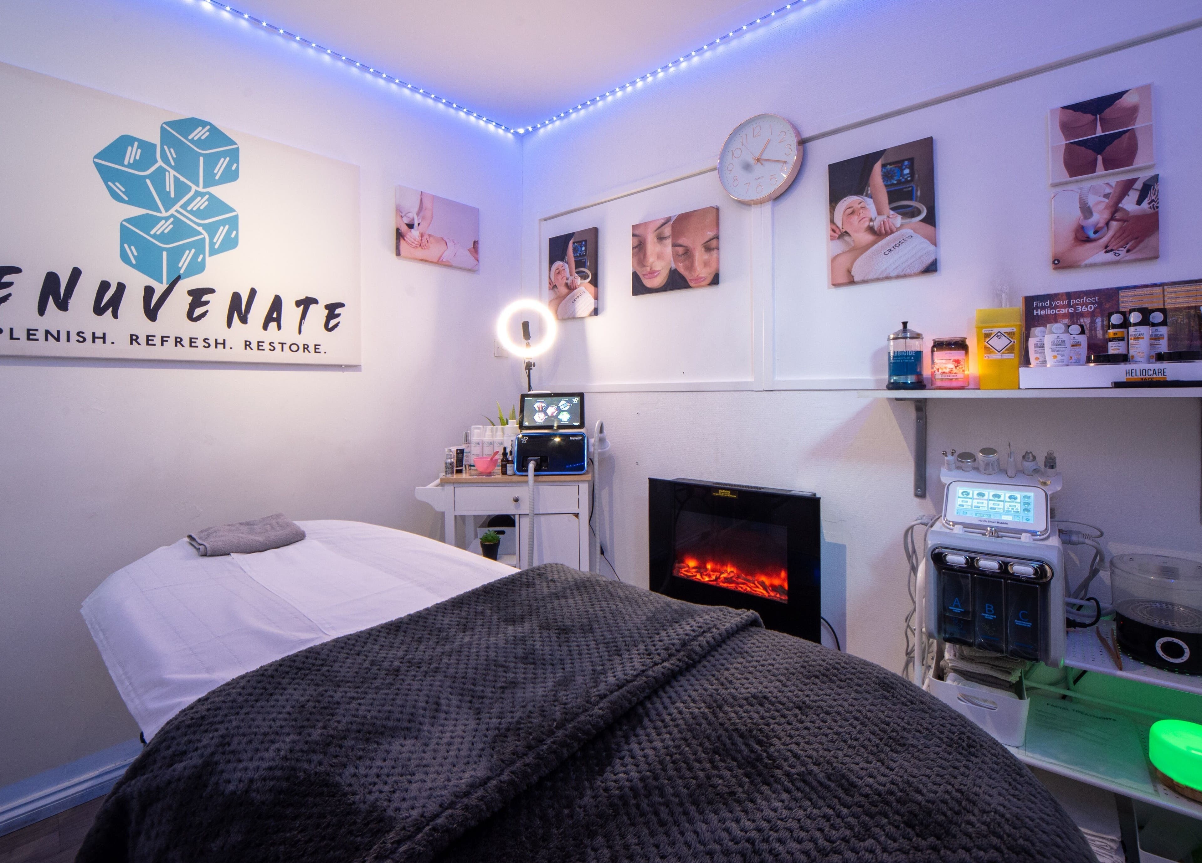 Relaxing spa room at Renuvenate Welling, England, GB with a cozy massage table and calming decor.
