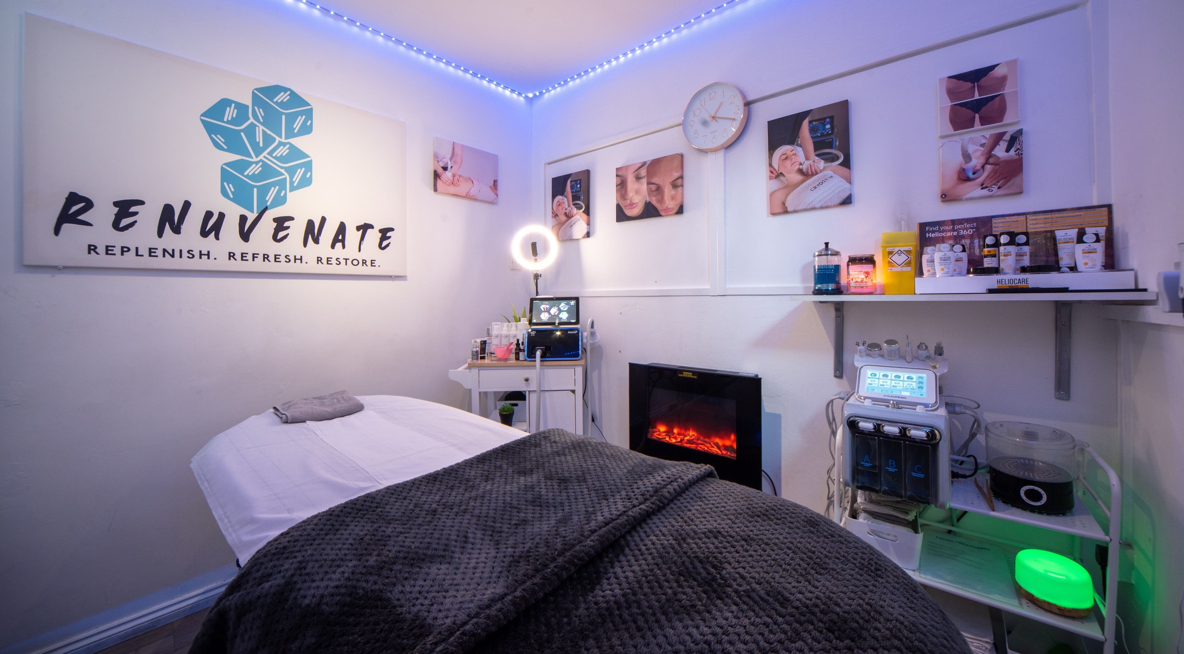 Relaxing spa room at Renuvenate Welling, England, GB with a cozy massage table and calming decor.