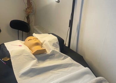 Treatment room at CPB Beauty, South Croydon, England, GB with a prepared spa bed and serene atmosphere.