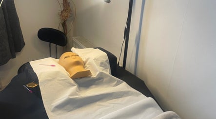 Treatment room at CPB Beauty, South Croydon, England, GB with a prepared spa bed and serene atmosphere.