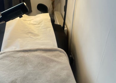 Tranquil treatment room at CPB Beauty, South Croydon, England, GB, featuring a comfortable massage bed.