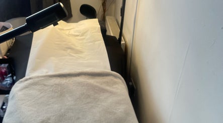 Tranquil treatment room at CPB Beauty, South Croydon, England, GB, featuring a comfortable massage bed.