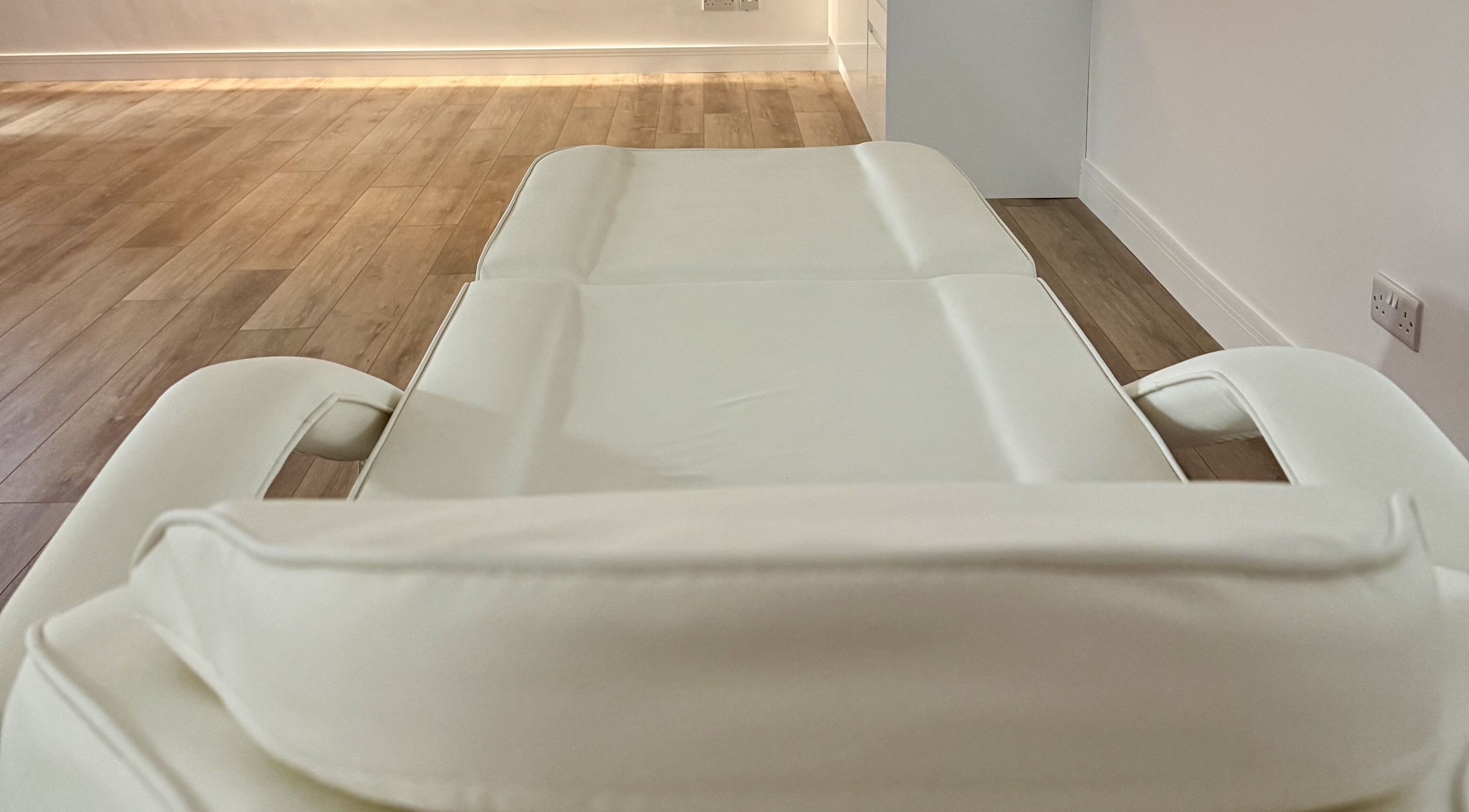 Treatment bed at Bio-Therapeutic Skin Clinic | Academy, Emsworth, England, GB, with wooden floors.