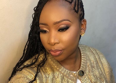 A stunning makeup look at MAZmerise Beauty Studio, Berea, Kwazulu-Natal, ZA showcasing flawless skin and elegant braids.