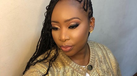 A stunning makeup look at MAZmerise Beauty Studio, Berea, Kwazulu-Natal, ZA showcasing flawless skin and elegant braids.