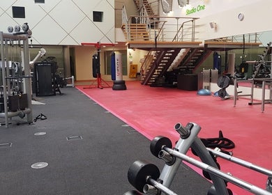Modern gym at AB Mental & Boxing Coach, London, England, GB, featuring state-of-the-art equipment and boxing area.
