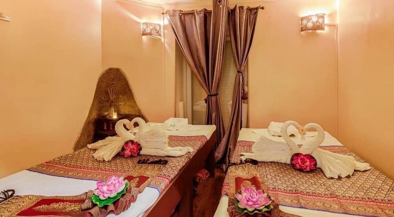 Elegant massage beds with towel swans at Wiphaspa2 Thai Massage in Paris, Île-de-France, FR.