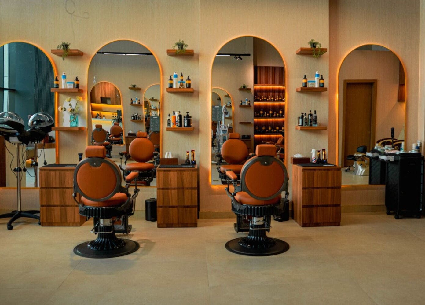 Modern interior of Bebek Gents Salon L.L.C in Dubai, AE, featuring sleek salon chairs and mirrors.