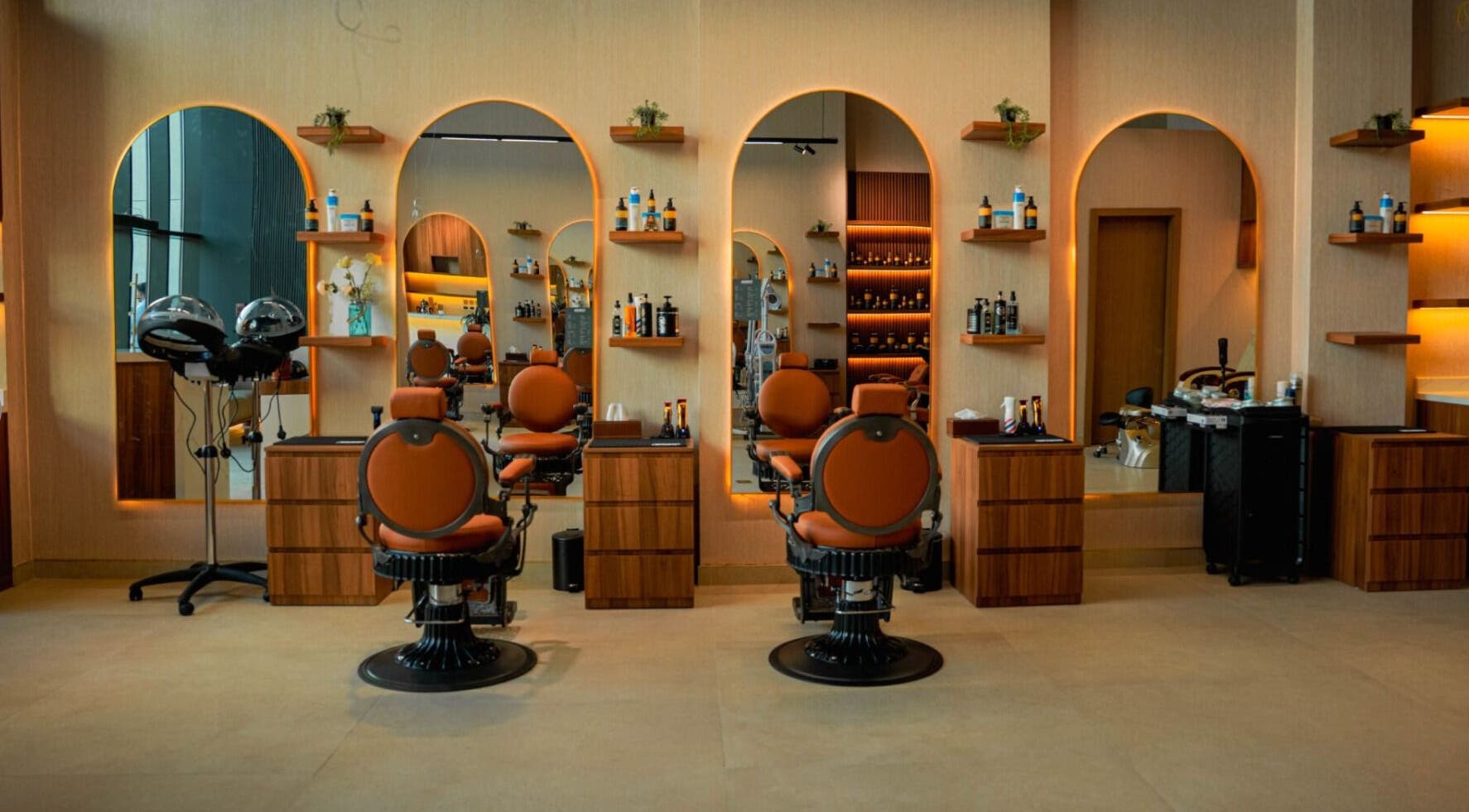 Modern interior of Bebek Gents Salon L.L.C in Dubai, AE, featuring sleek salon chairs and mirrors.