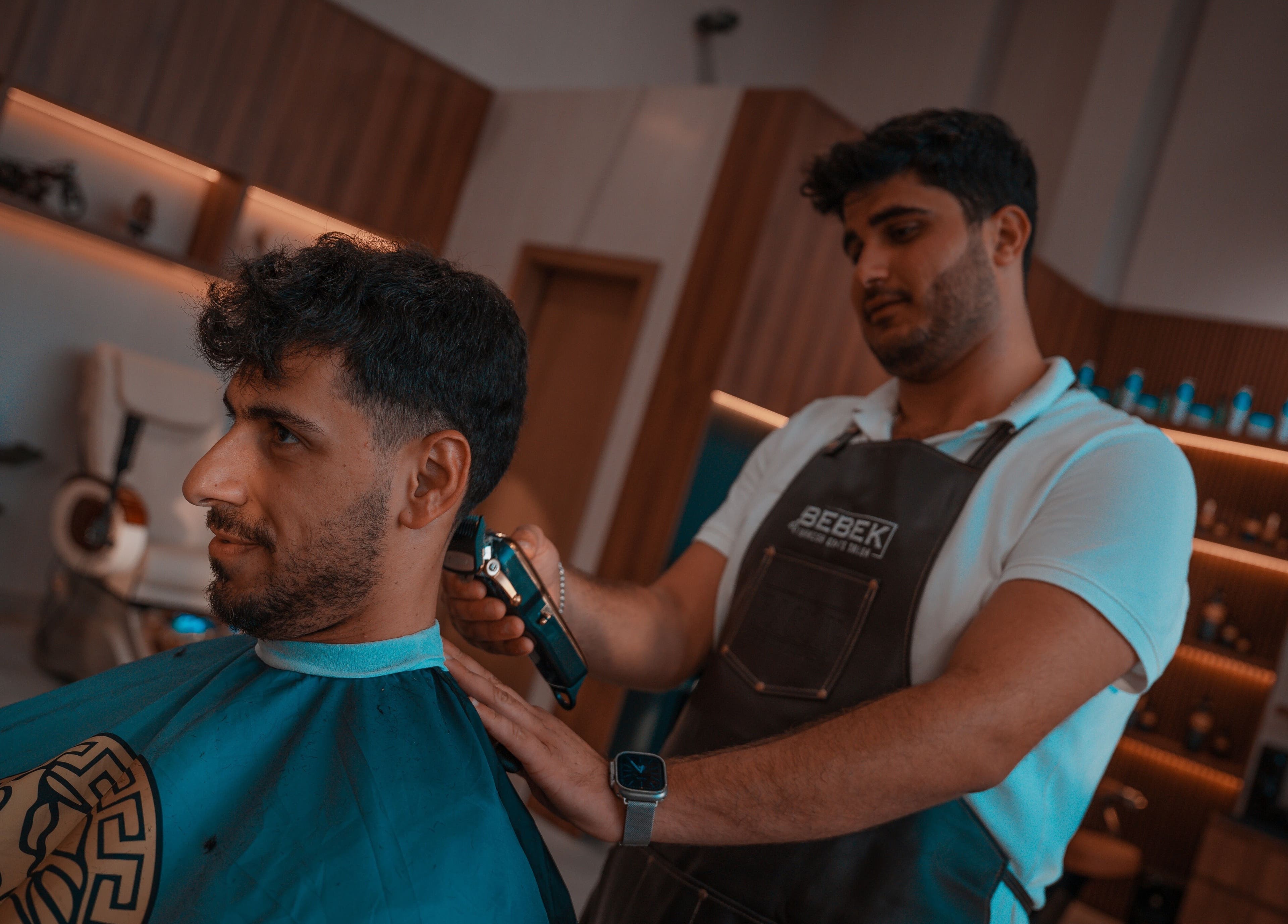 Gentleman receiving a stylish haircut at Bebek Gents Salon L.L.C, Dubai, AE.