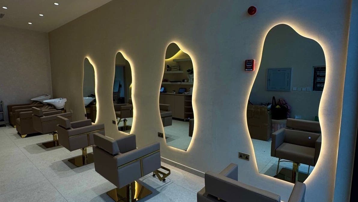 Elegant salon interior with chic mirrors at Blowhaus Beauty Studio, Dubai, AE.