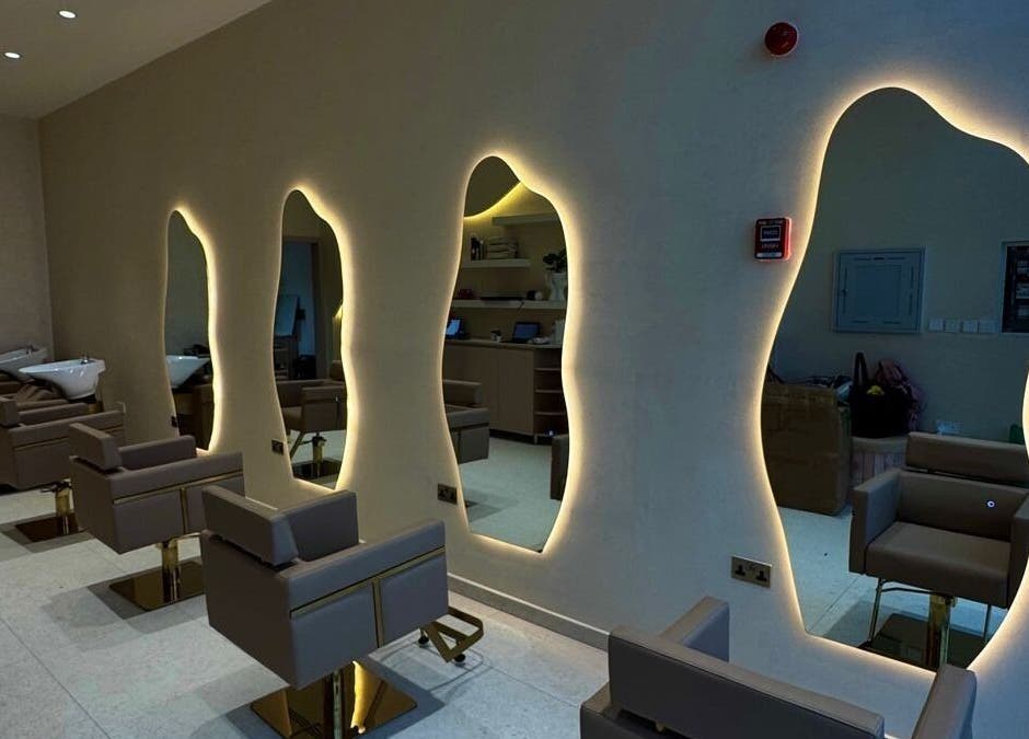 Elegant salon interior with chic mirrors at Blowhaus Beauty Studio, Dubai, AE.