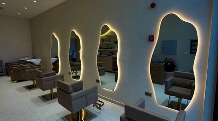 Elegant salon interior with chic mirrors at Blowhaus Beauty Studio, Dubai, AE.