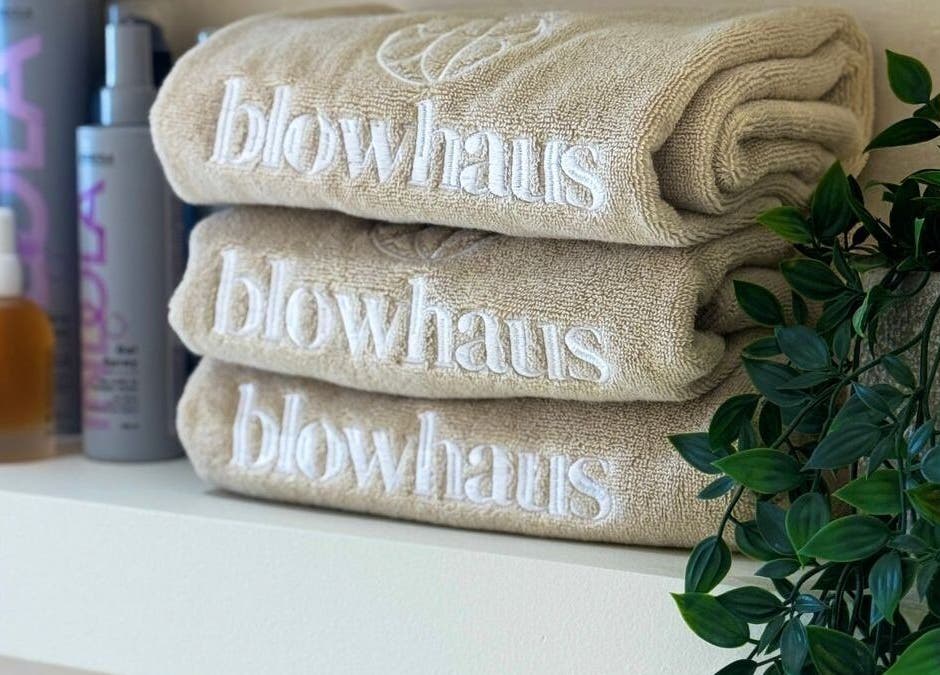 Elegant towels and products at Blowhaus Beauty Studio in Dubai, AE, showcasing comfort and quality.