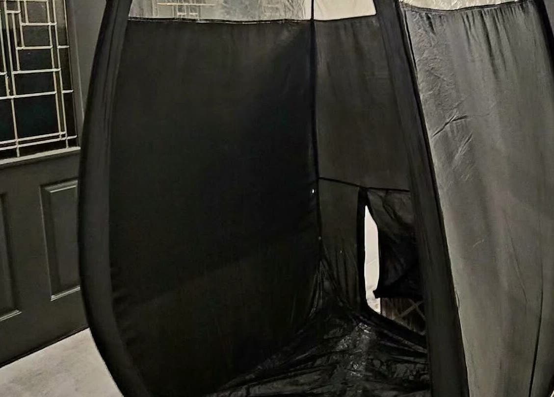 Portable spray tan booth at Glow on the Go, Paisley, Scotland, GB, offers convenient tanning sessions.