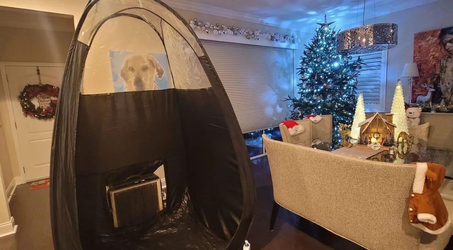 Cozy festive setup at Glow on the Go, Paisley, Scotland, GB, featuring a tanning tent and holiday décor.