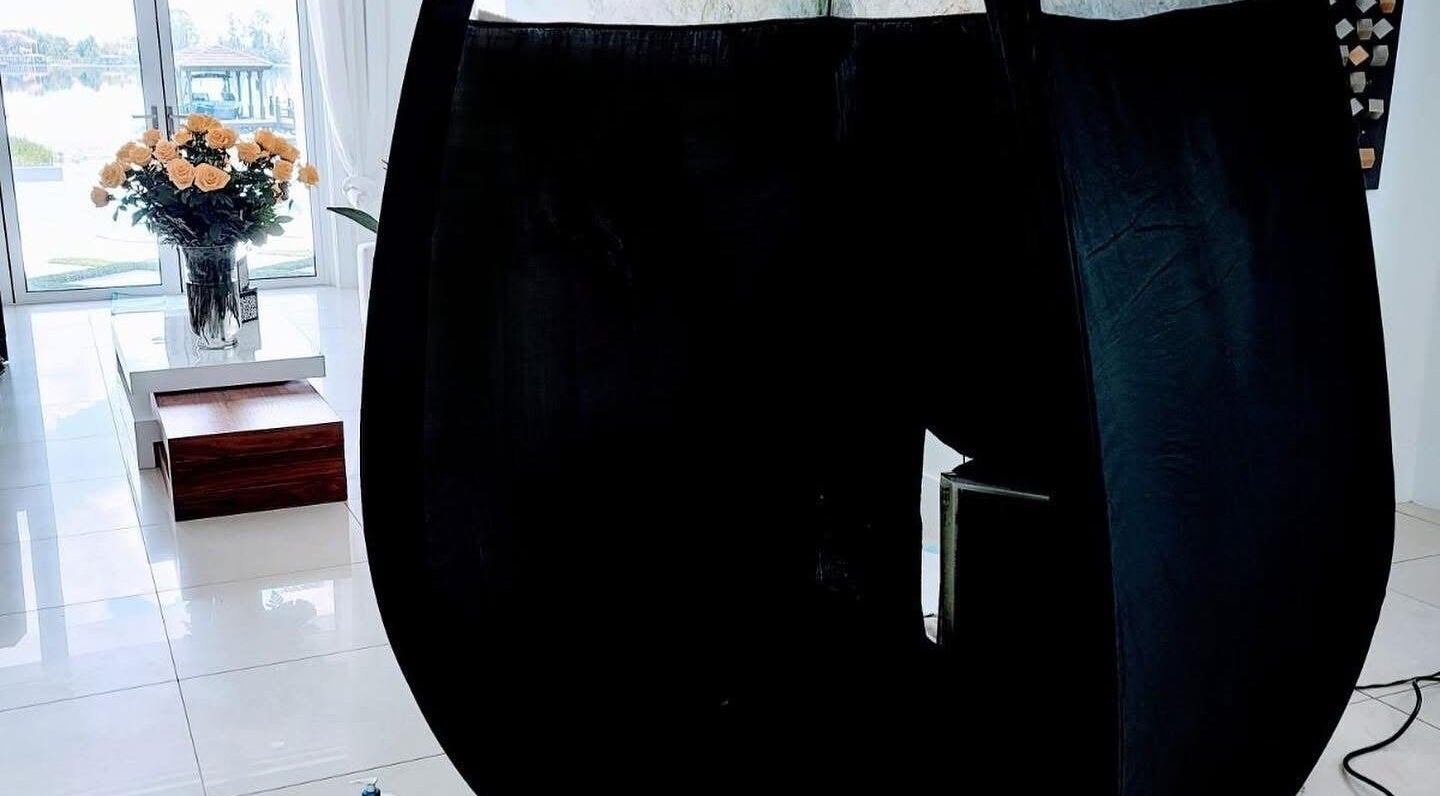 Modern salon interior at Glow on the Go in Paisley, Scotland, GB with bright lighting and floral decor.