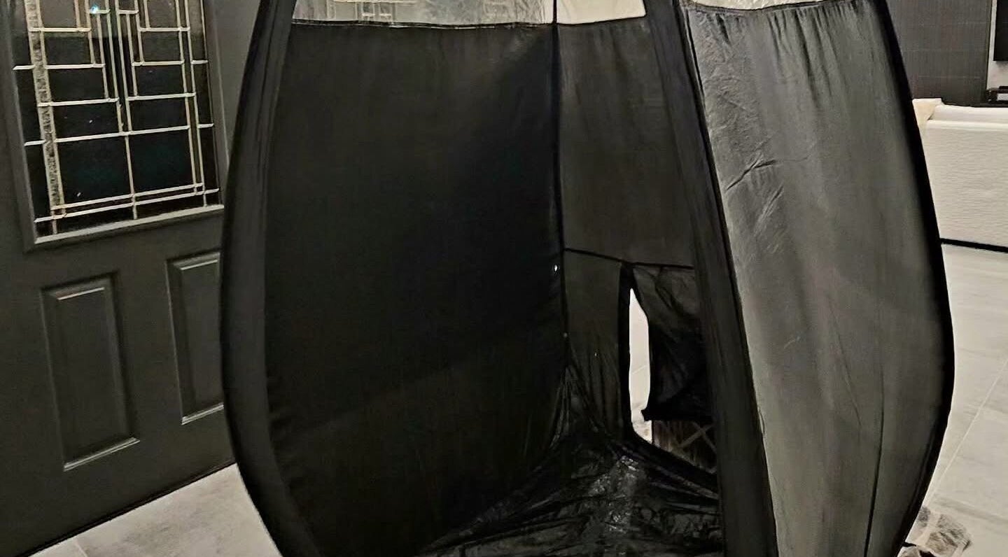 Modern tanning booth at Glow on the Go, Paisley, Scotland, GB offering premium sunless tanning services.