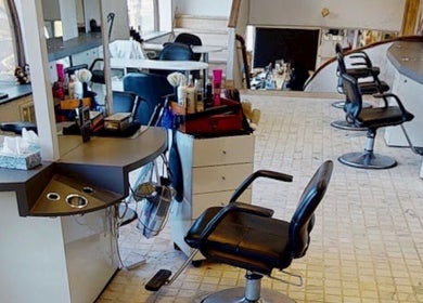 Modern salon interior at JulietteHaistylist, Montréal, Québec, CA with sleek styling chairs and workstations.