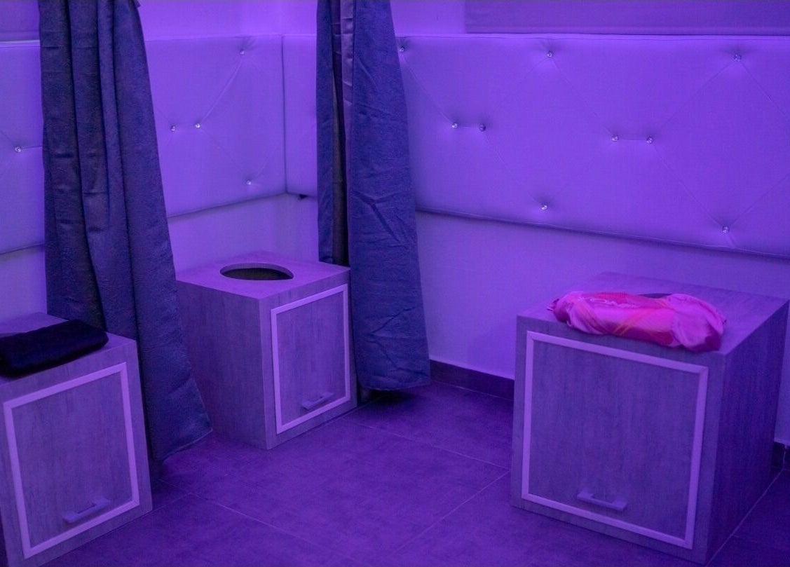 Yoniverse Curaçao spa room with seating in soothing light, Willemstad, Curaçao, CW.