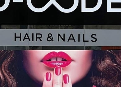 D Code Hair & Nails sign in Ħaż-żebbuġ, MT showcases bold style with vibrant lips and nails.