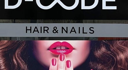 D Code Hair & Nails sign in Ħaż-żebbuġ, MT showcases bold style with vibrant lips and nails.