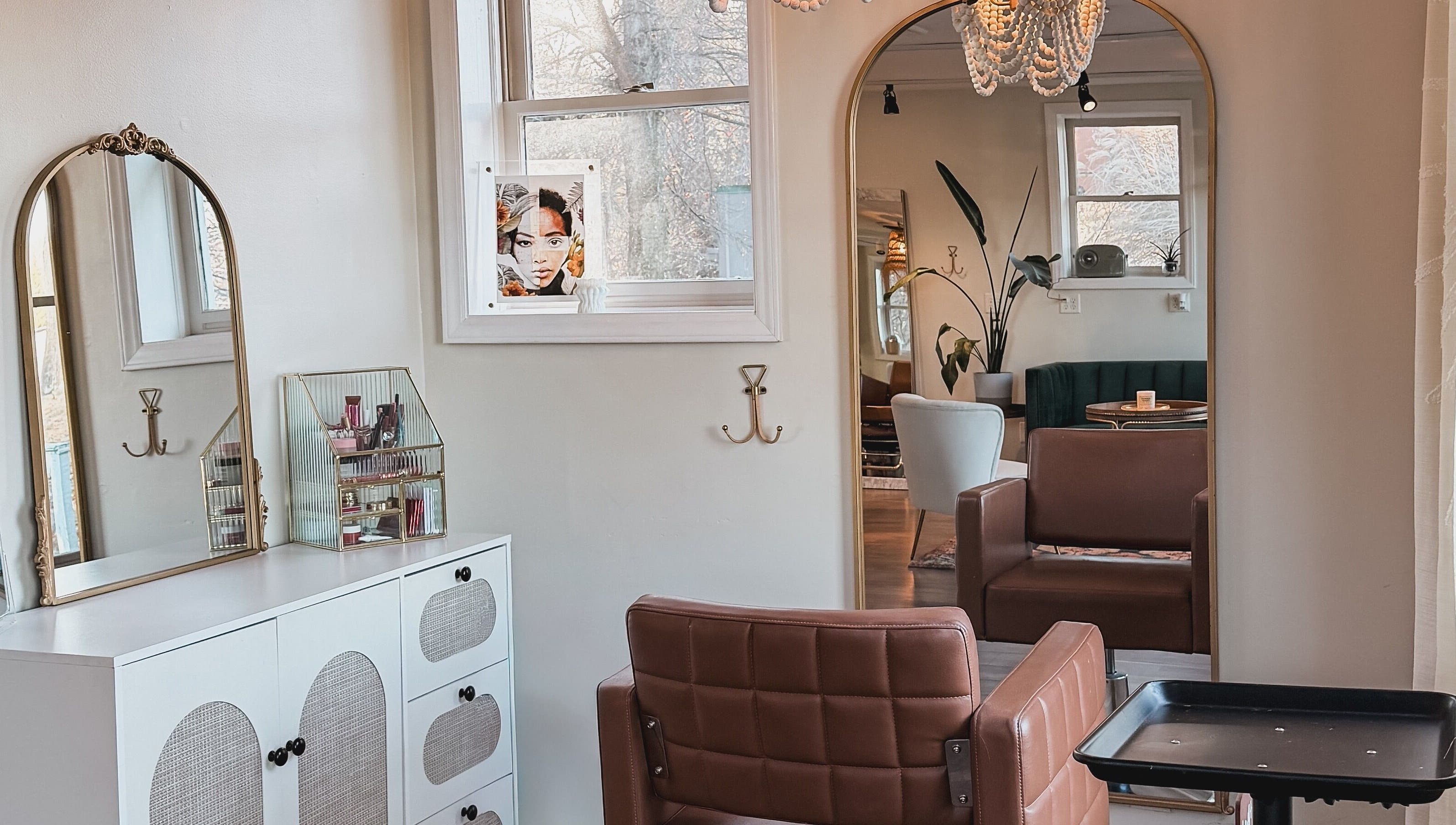 Elegant salon interior at Brushes and Braids, Asheville, North Carolina, US, showcasing modern decor and seating.
