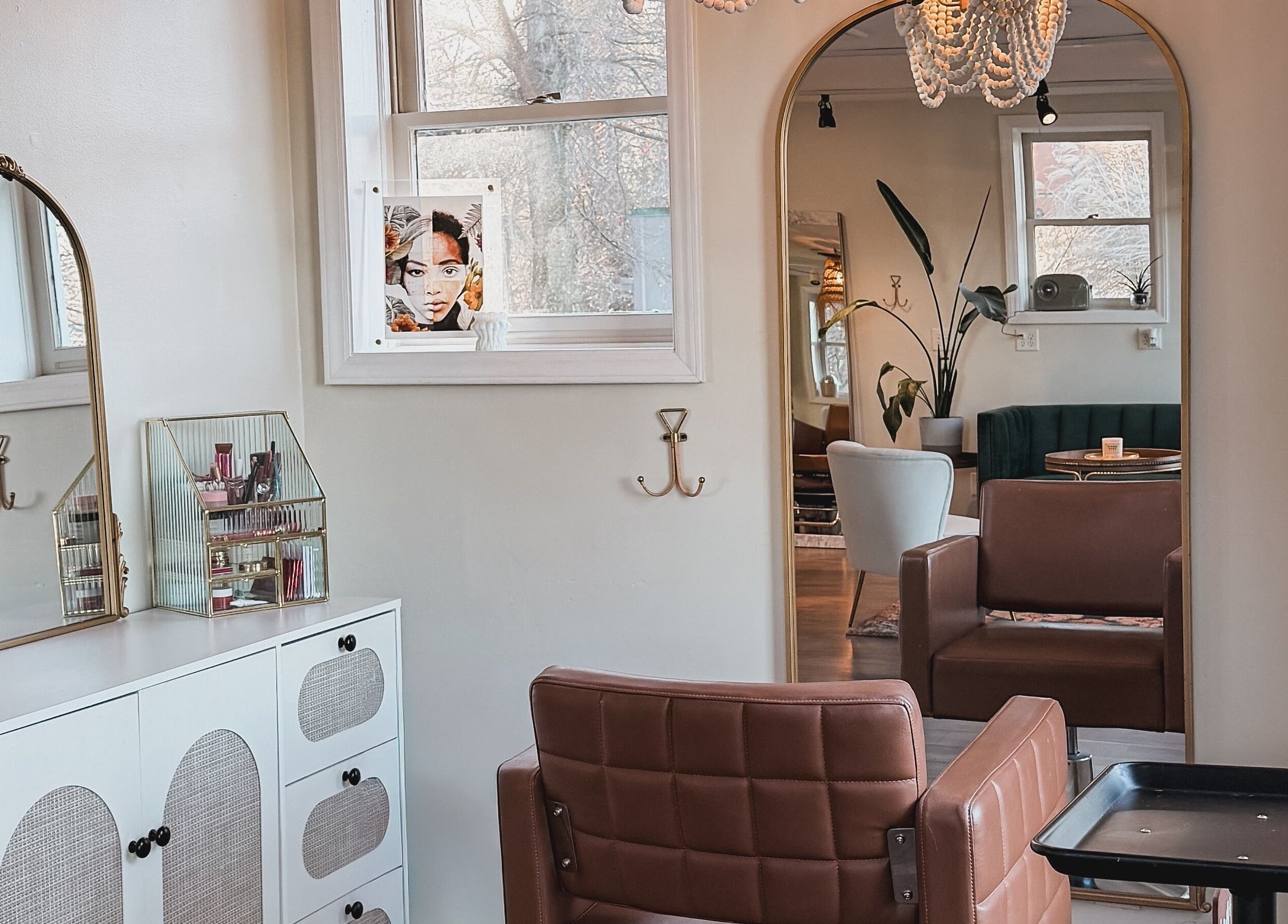 Elegant salon interior at Brushes and Braids, Asheville, North Carolina, US, showcasing modern decor and seating.