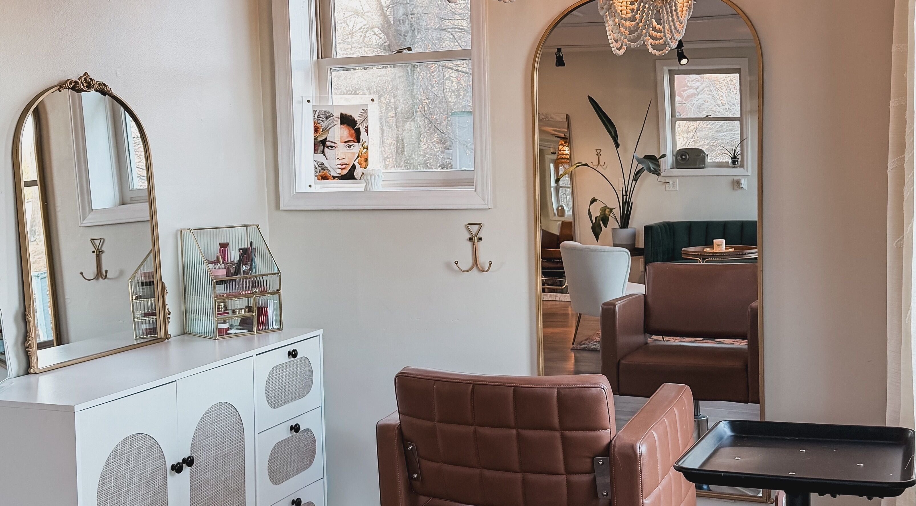 Elegant salon interior at Brushes and Braids, Asheville, North Carolina, US, showcasing modern decor and seating.