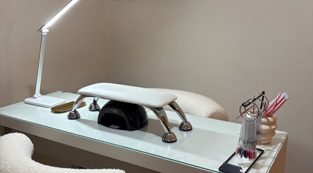 Nail station at glossedbygracie in Nuneaton, England, GB, featuring a modern lamp and nail tools.