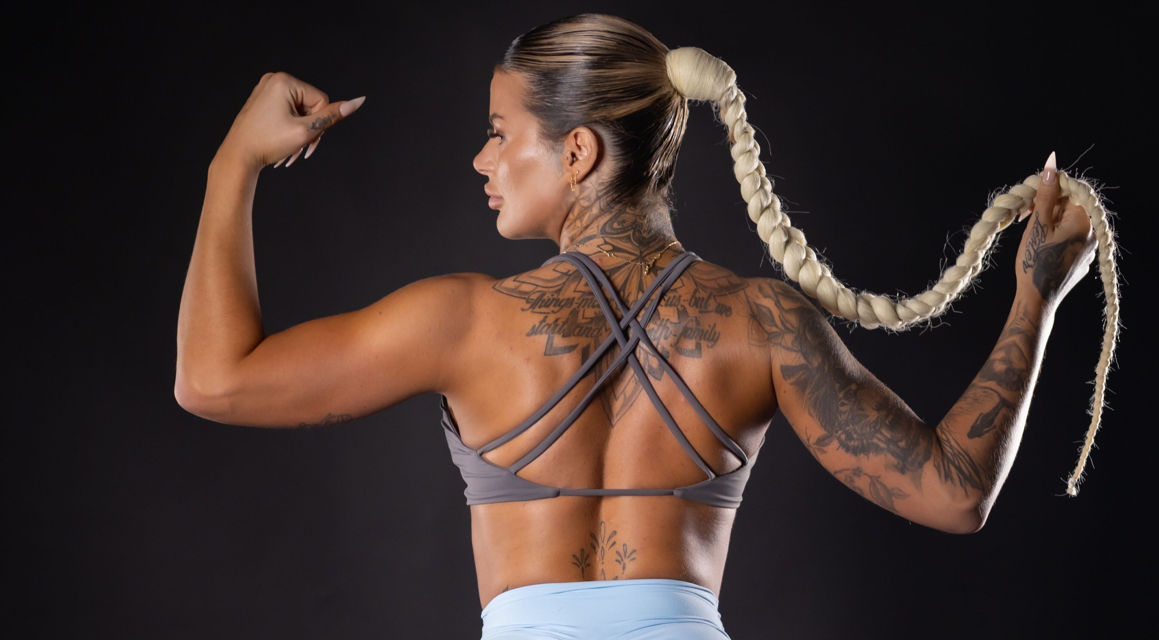 Strong woman with braided hair and tattoos at Glutebyjol, Longueuil, Québec, CA.