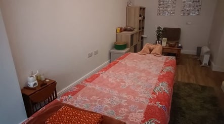 Relaxing massage room at Wan's Healing Massage in Saint Mellons, Wales, GB featuring a cozy treatment table.