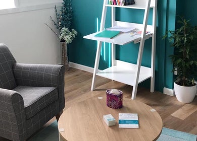 Chic waiting area at Beingwell, Dundee, Scotland, GB with armchairs, table, and vibrant decor.
