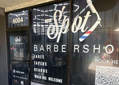 Front entrance of The Spot barbershop in Los Angeles, California, US, showcasing its modern sign.