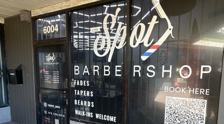 Front entrance of The Spot barbershop in Los Angeles, California, US, showcasing its modern sign.