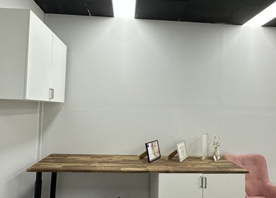 Modern workspace at Lash.PrettyUp with wooden desk and pink chair, Melbourne, Victoria, AU.