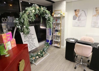 Interior of Amelia’s Nails and Beauty, Port Erin, showcasing a manicure station and product display.