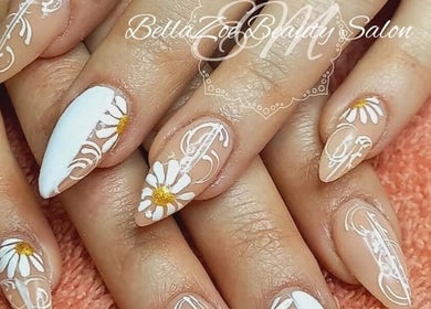 Detailed nail art with floral designs at BellaZoe Nail Salon, located in Klerksdorp, ZA.