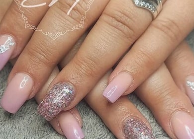 Elegant pink and glitter nails at BellaZoe Nail Salon, klerksdorp, ZA. Perfect for a chic manicure.