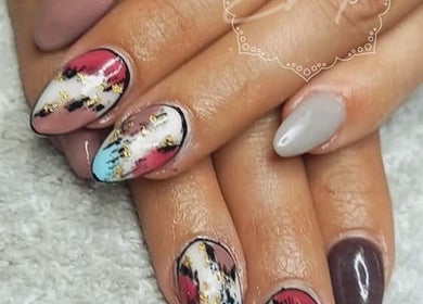 Artistic nail art design at BellaZoe Nail Salon in Klerksdorp, ZA. Features vibrant and intricate patterns.