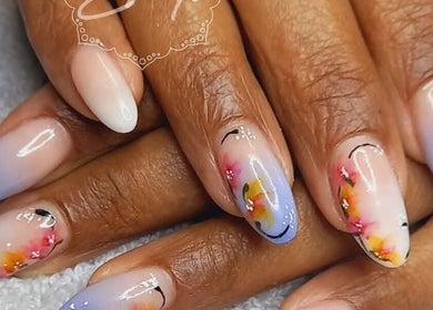Floral nail art design at BellaZoe Nail Salon in Klerksdorp, ZA showcasing vibrant color gradients.