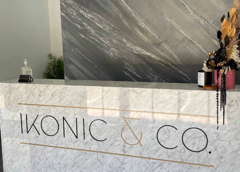 Elegant reception at Ikonic & co Hair & beauty in Ballarat East, Victoria, AU with marble counter and floral decor.