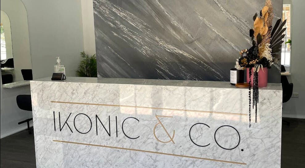 Elegant reception at Ikonic & co Hair & beauty in Ballarat East, Victoria, AU with marble counter and floral decor.