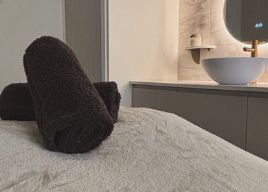 Luxury spa setup at House of Beauty by Sarah, Clayton-le-woods, England, GB featuring plush towels and a chic sink.