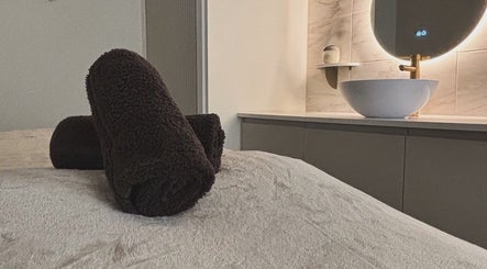 Luxury spa setup at House of Beauty by Sarah, Clayton-le-woods, England, GB featuring plush towels and a chic sink.