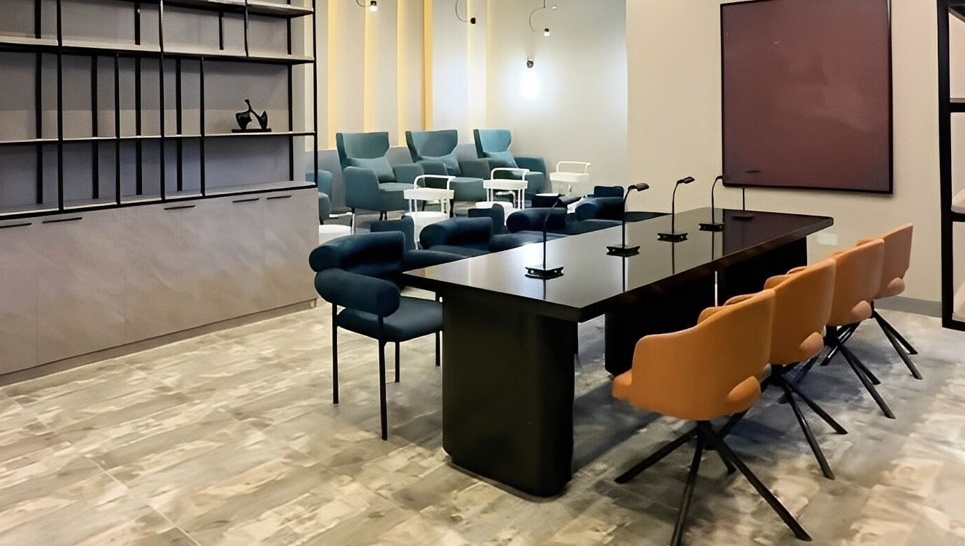 Modern interior of Aiona - The Art of Nails in Lagos, Lagos, NG with stylish seating and sleek tables.